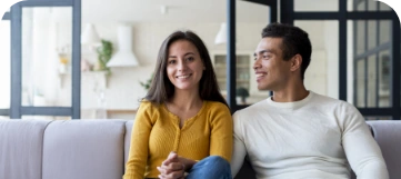 lovely-couple-sitting-sofa